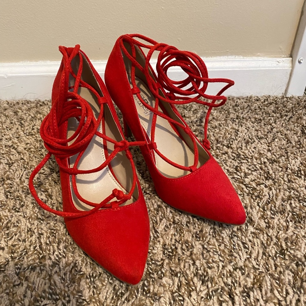 Lace up red heels